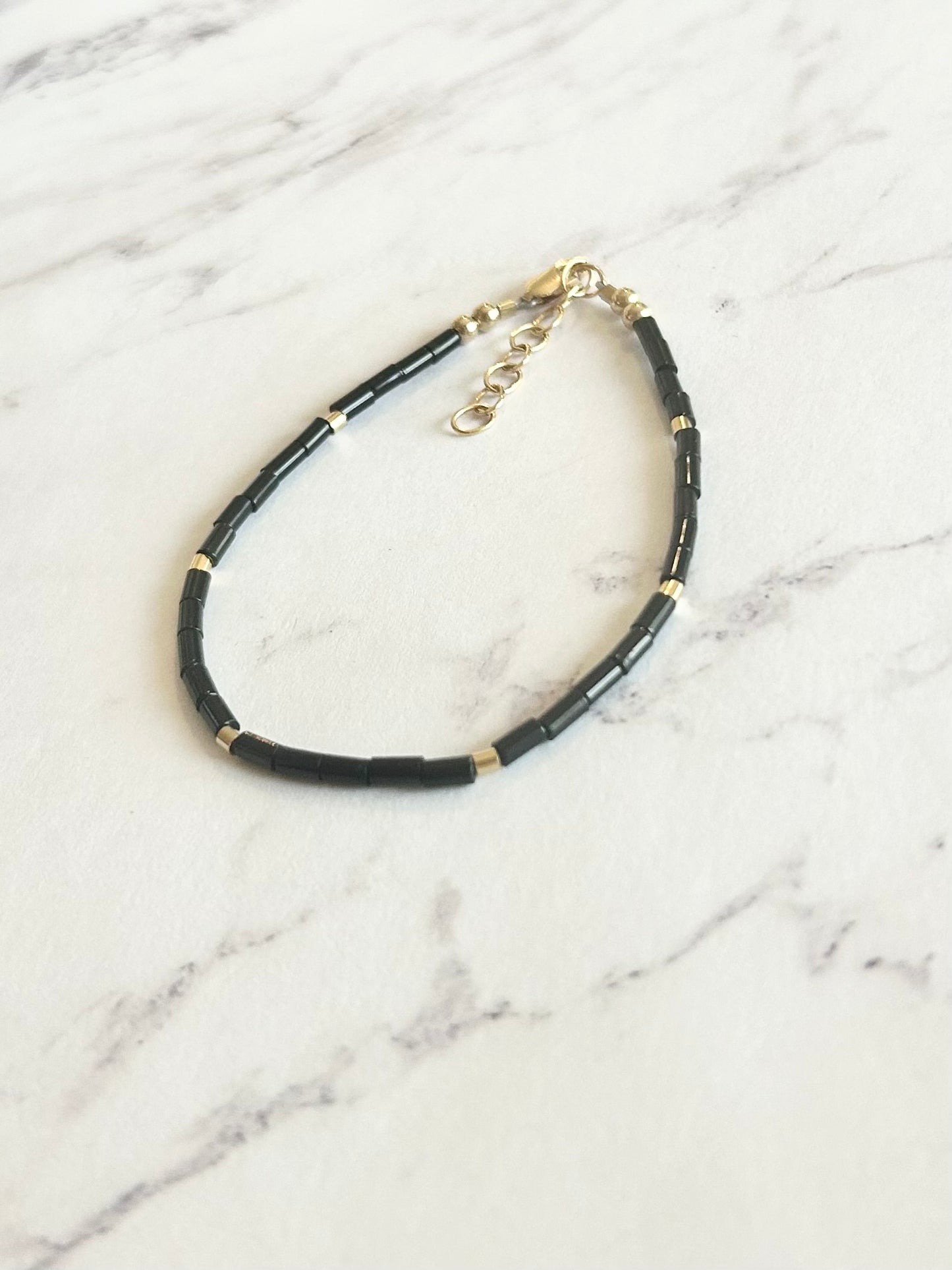 Med/Large Onyx + Gold Cylinder Bracelet (1 available)