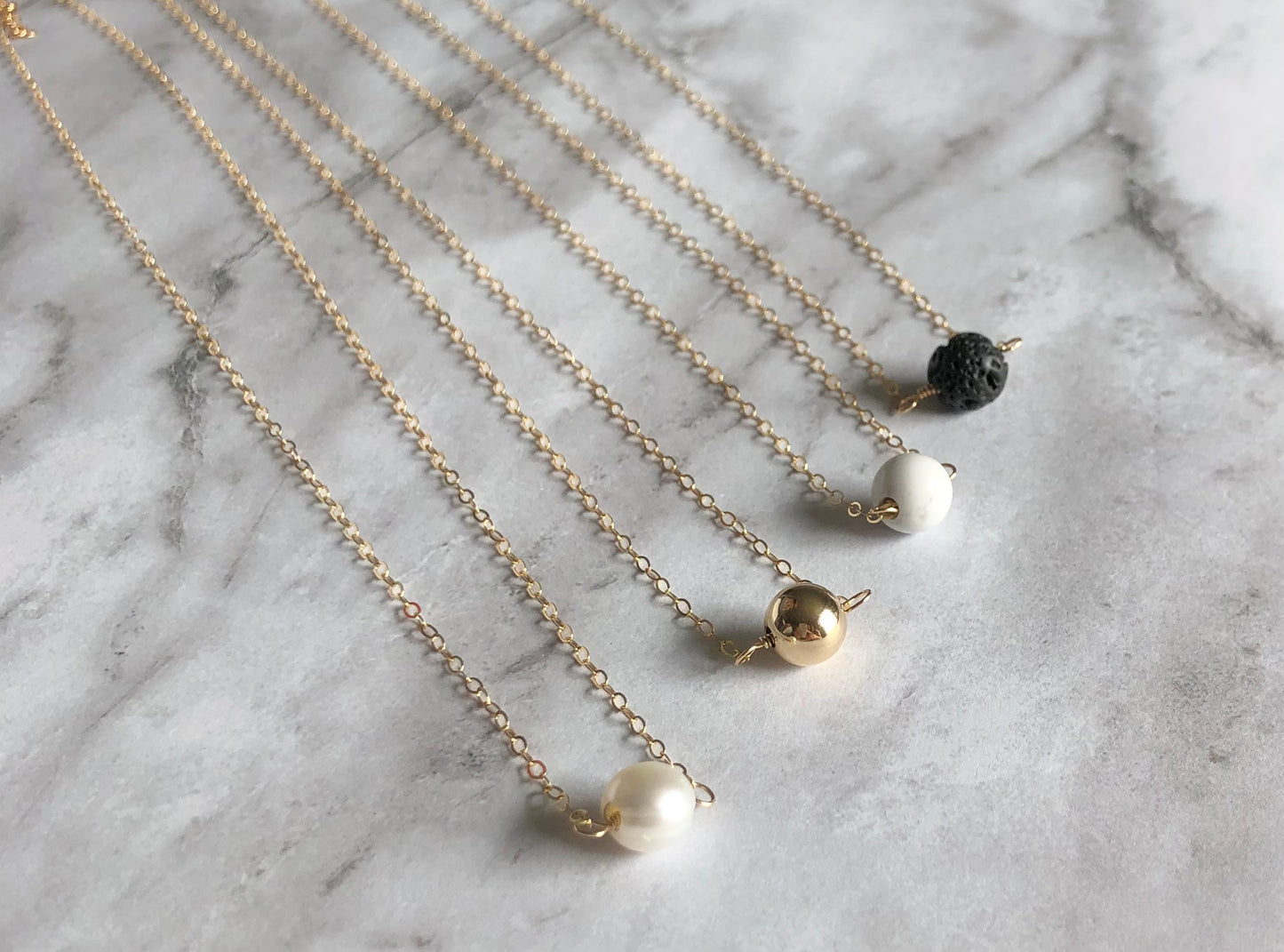 Marbled Solitaire Necklace (Third from the left)